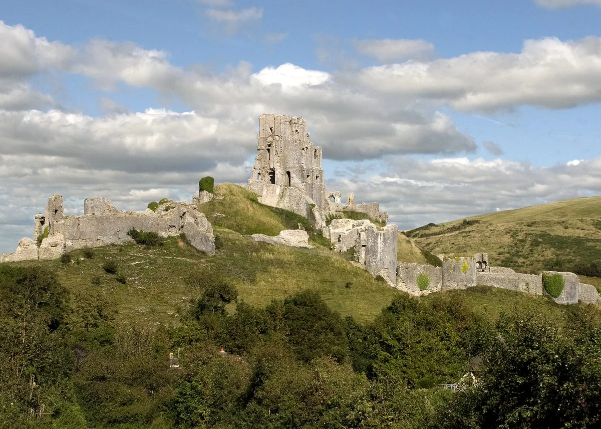 Corfe Castle ruins rising above the village of Corfe Castle in Dorset