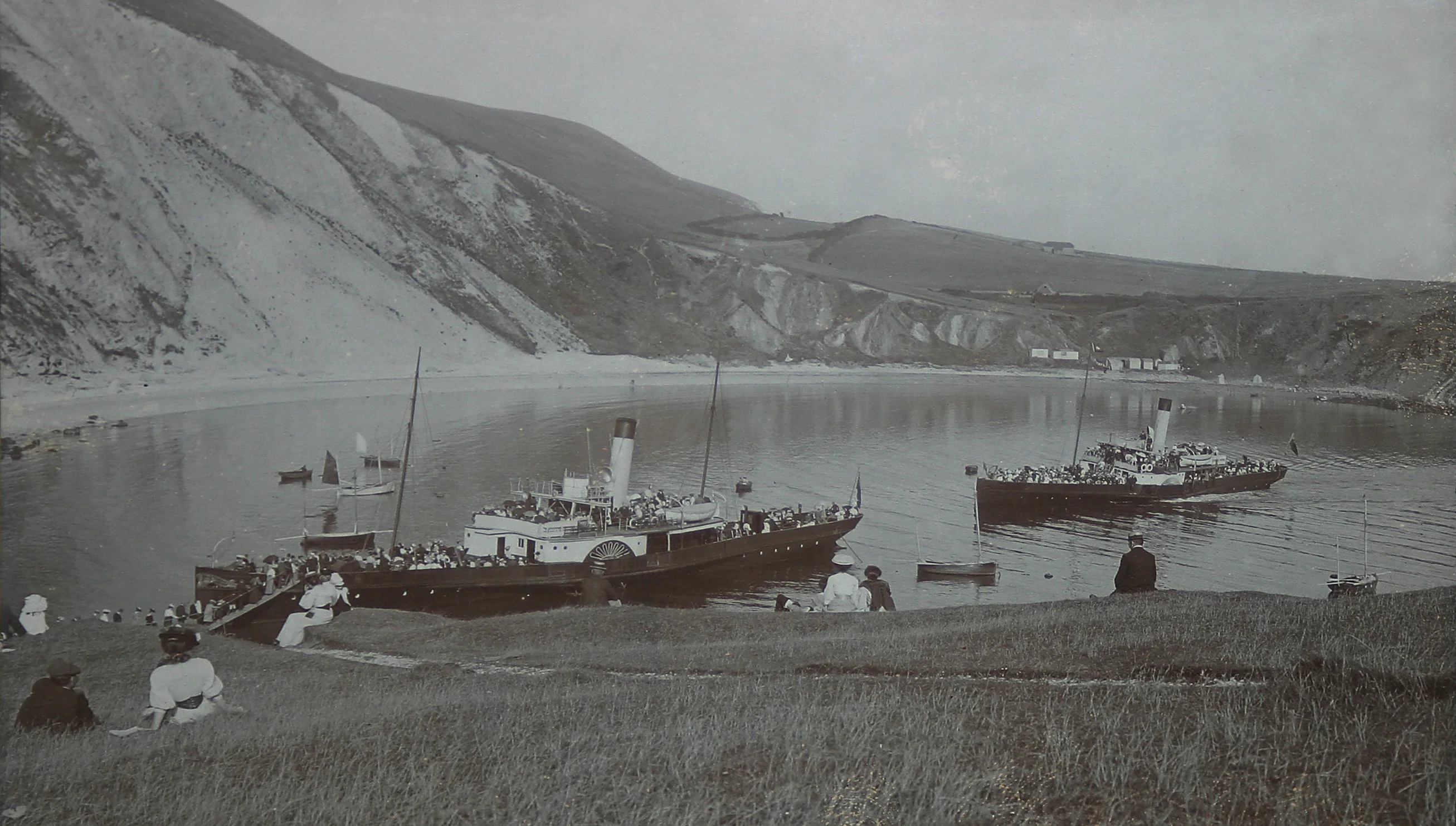 Two paddle steamers moored in Lulworth Cove, Edwardian era