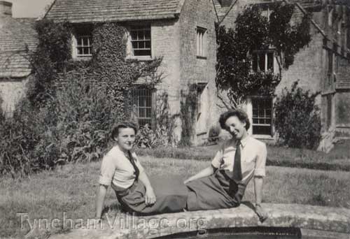 Two members of the WAAF sitting outside The Great House